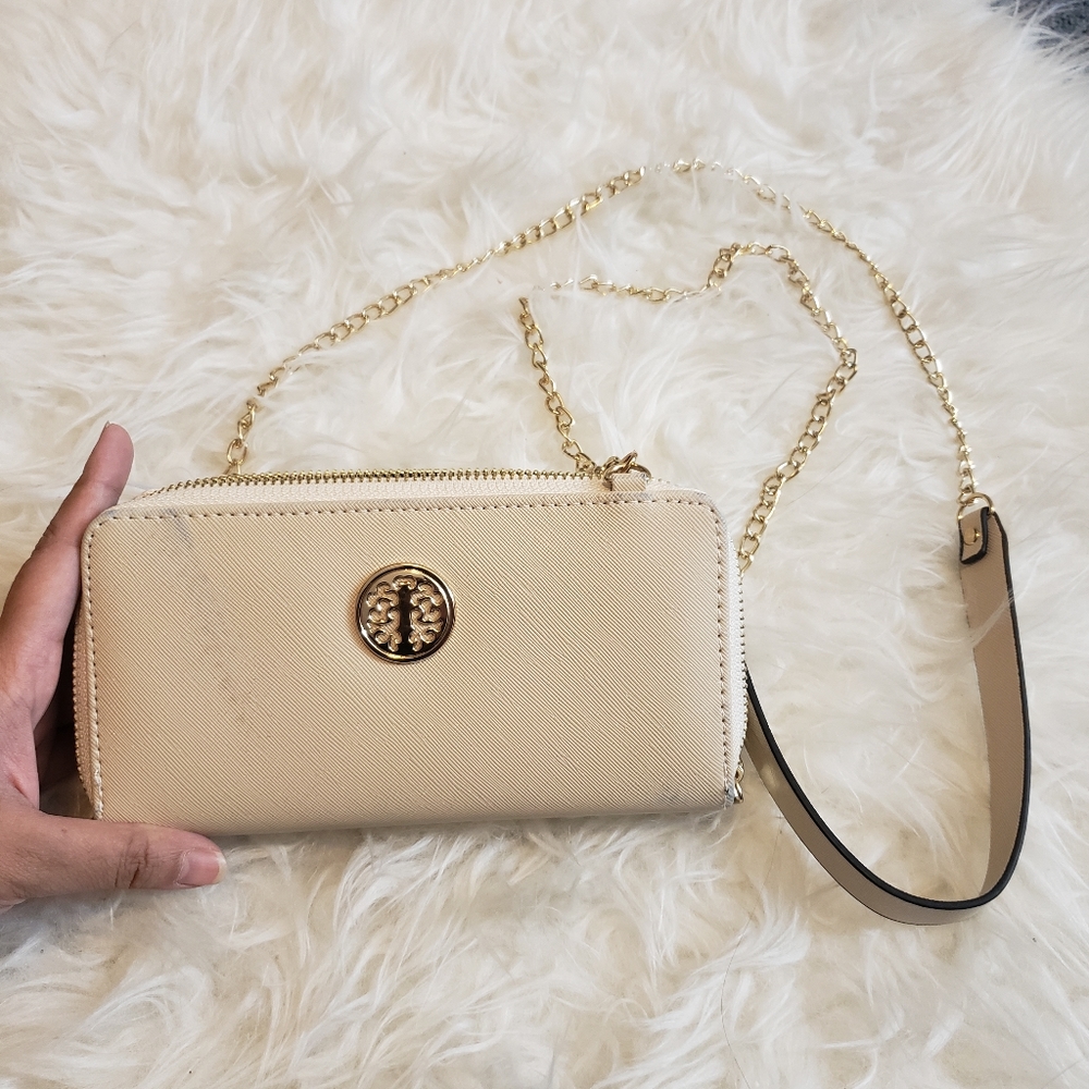 Creme Wallet with shoulder strap and wrist strap Used some marks on the front
